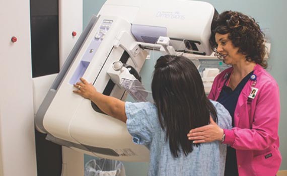 patient having mammogram with nurse